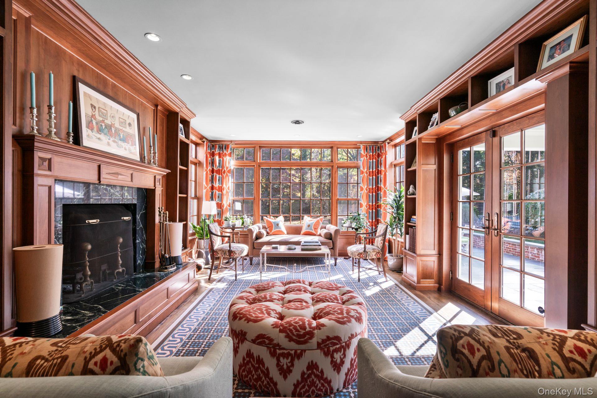 30 Underhill Road Locust Valley, NY 11560 - Photo 14 of 32 a living room with furniture fireplace and a large window