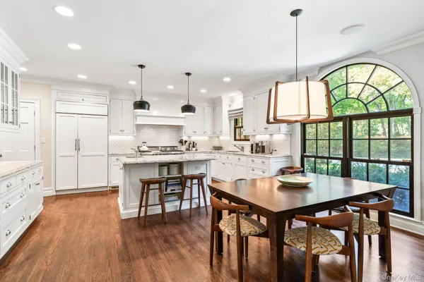a open kitchen with a table and chairs