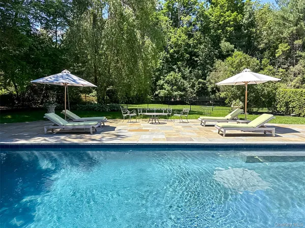 a swimming pool with an outdoor space and swimming pool