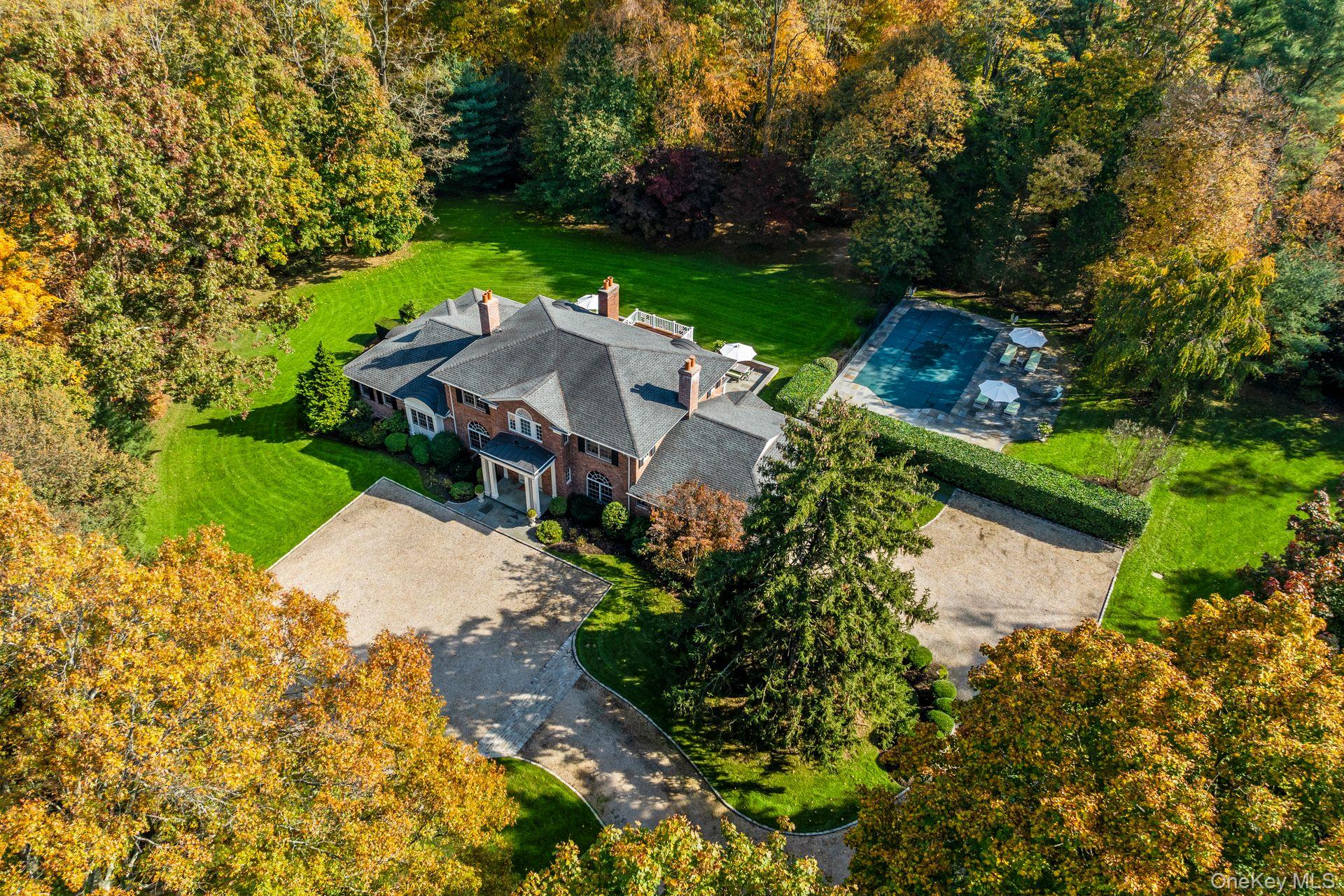 30 Underhill Road Locust Valley, NY 11560 - Photo 3 of 32 an aerial view of a house with a garden