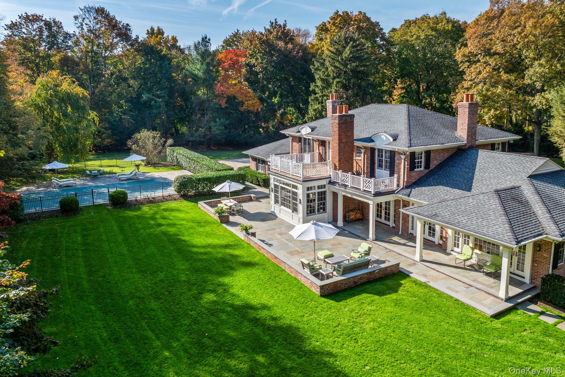 30 Underhill Road Locust Valley, NY 11560 - Photo 32 of 32 an aerial view of a house with swimming pool garden and patio