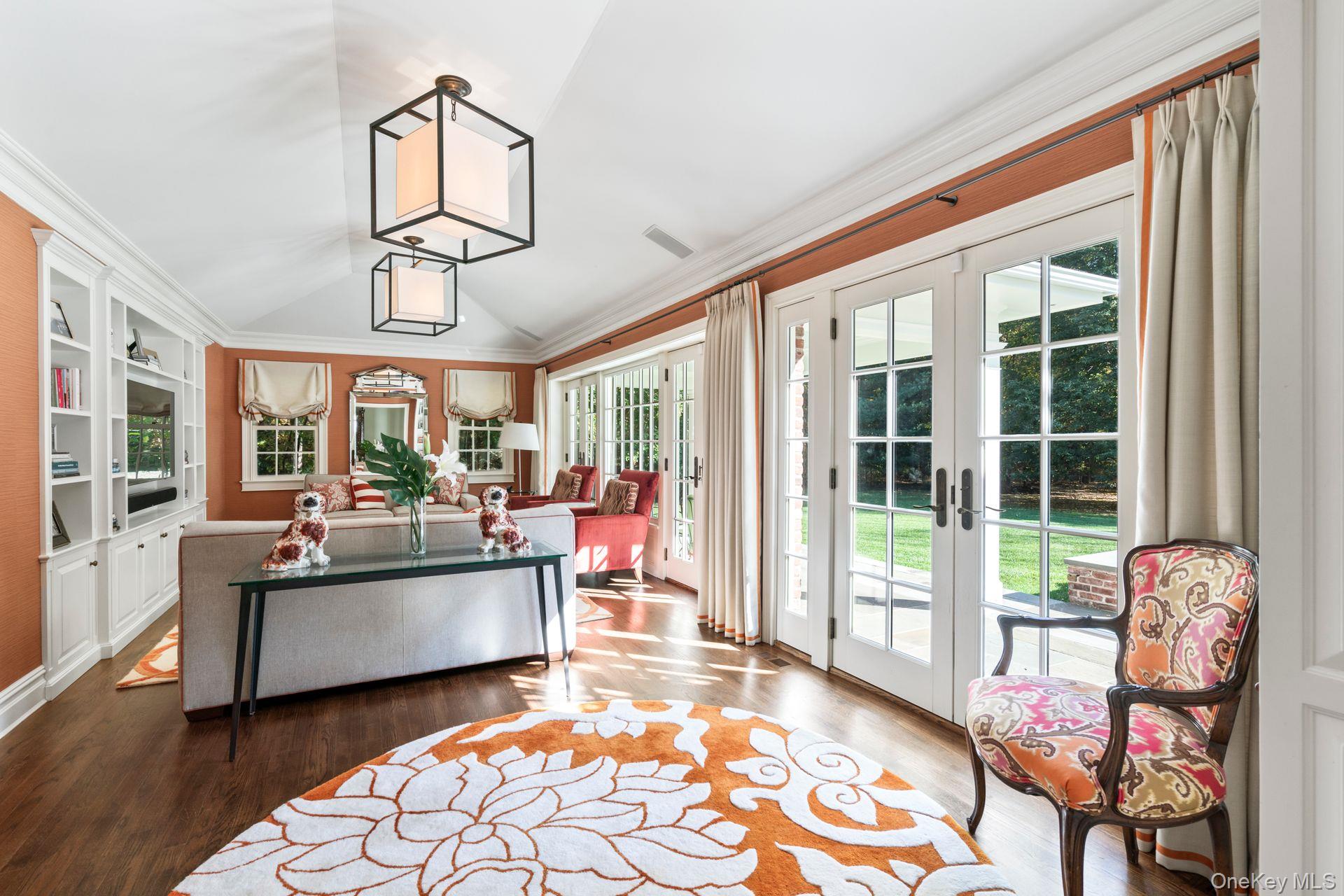 30 Underhill Road Locust Valley, NY 11560 - Photo 8 of 32 a living room with furniture fireplace and a large window