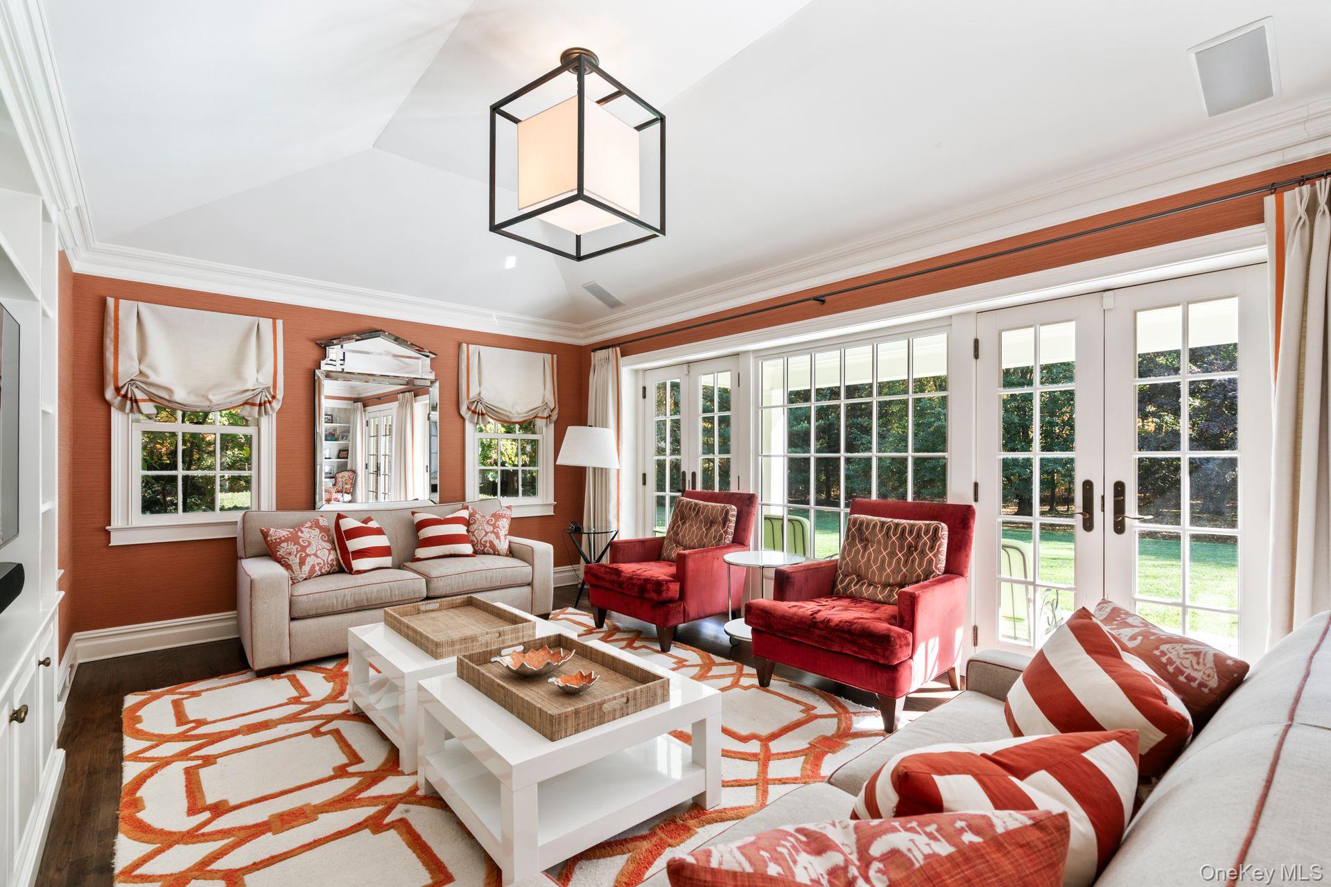 30 Underhill Road Locust Valley, NY 11560 - Photo 10 of 32 a living room with furniture and floor to ceiling windows