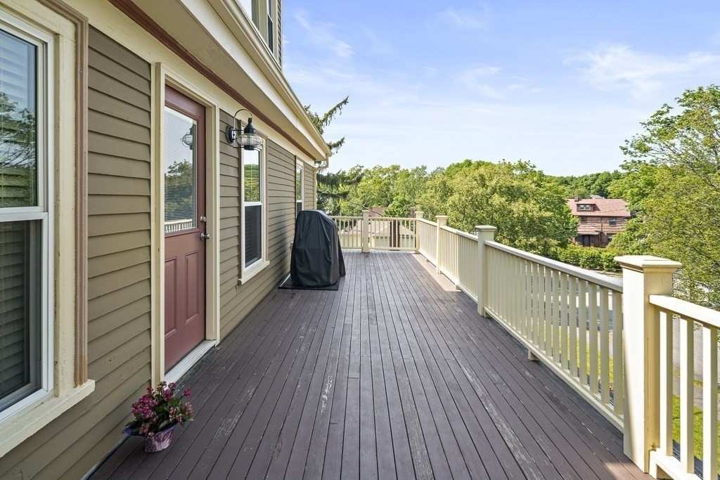 1281 Walnut Street, Unit 2 Newton, MA 02461 - Photo 15 of 30 a view of a balcony with wooden floor and fence