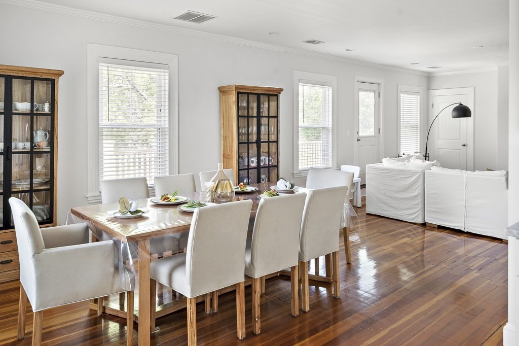 1281 Walnut Street, Unit 2 Newton, MA 02461 - Photo 16 of 30 a view of a dining room with furniture and wooden floor