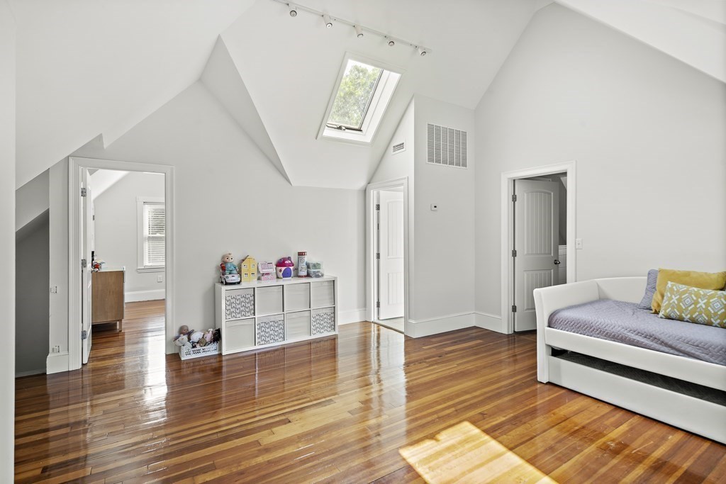 1281 Walnut Street, Unit 2 Newton, MA 02461 - Photo 27 of 30 a living room with furniture and a wooden floor