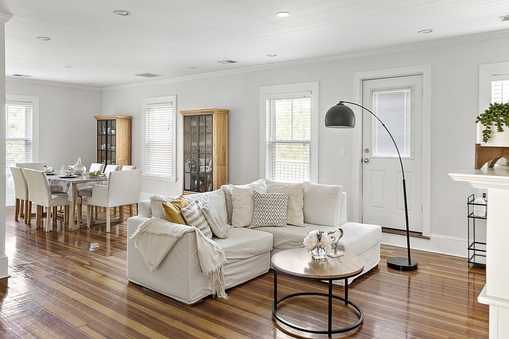 1281 Walnut Street, Unit 2 Newton, MA 02461 - Photo 3 of 30 a living room with furniture and a dining table with wooden floor