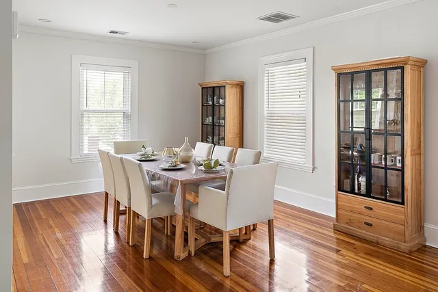 a view of a dining room with furniture and wooden floor