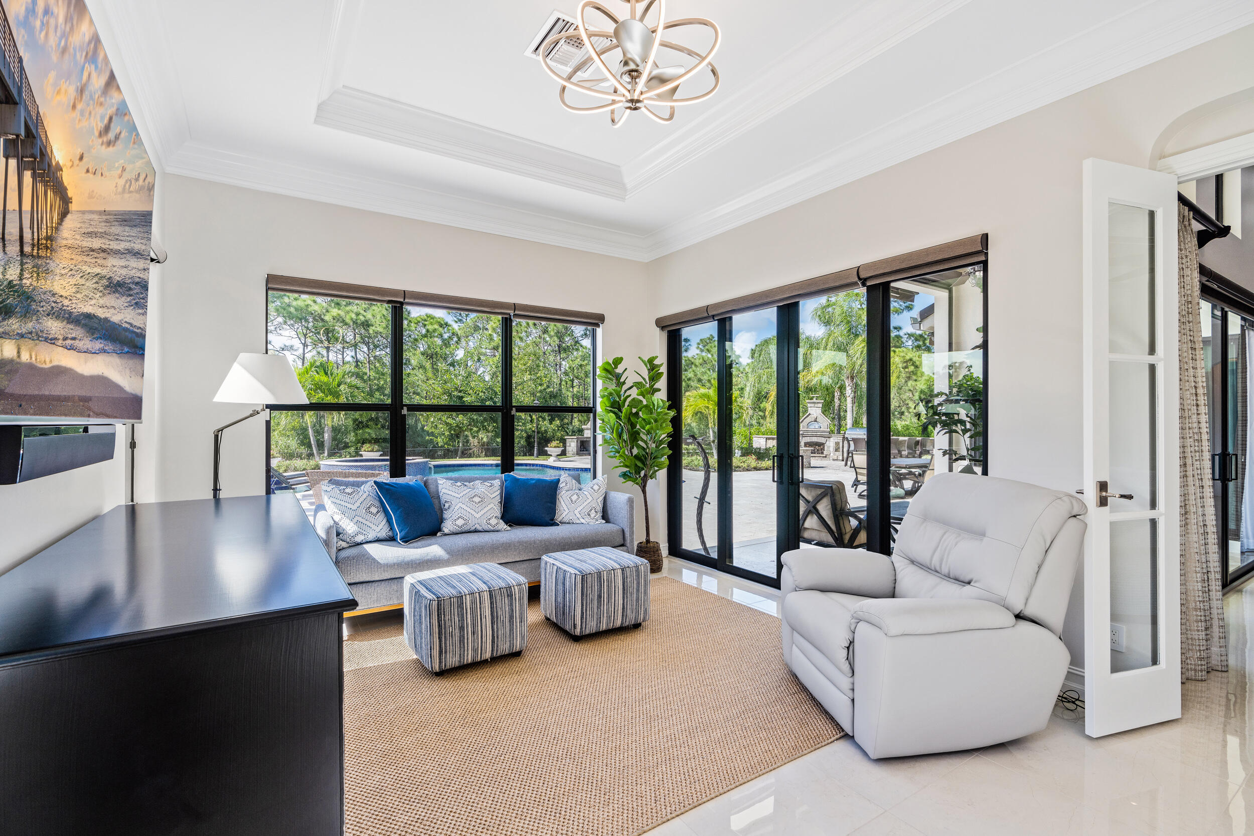 19240 Southeast Hidden Bridge Court Jupiter, FL 33458 - Photo 18 of 42 a living room with furniture and a large window