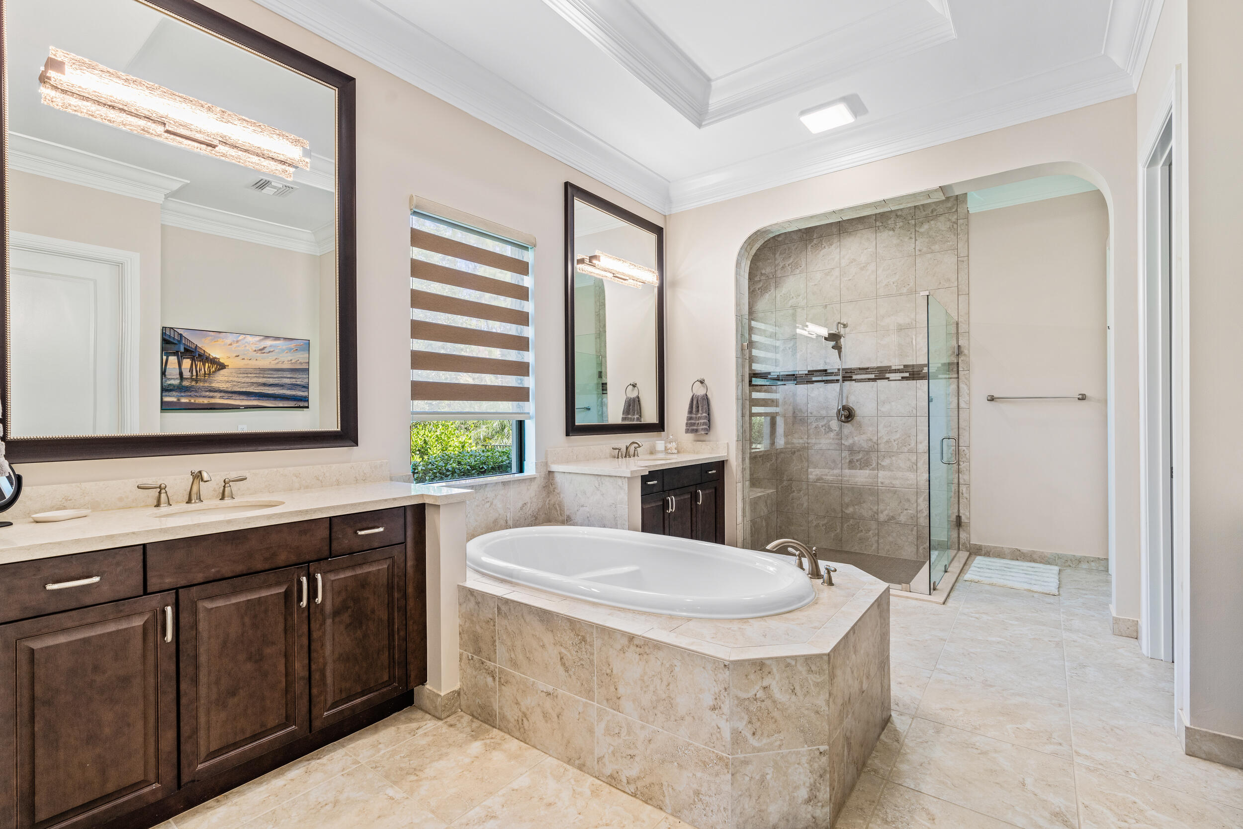 19240 Southeast Hidden Bridge Court Jupiter, FL 33458 - Photo 23 of 42 a bathroom with a granite countertop sink mirror bathtub and toilet