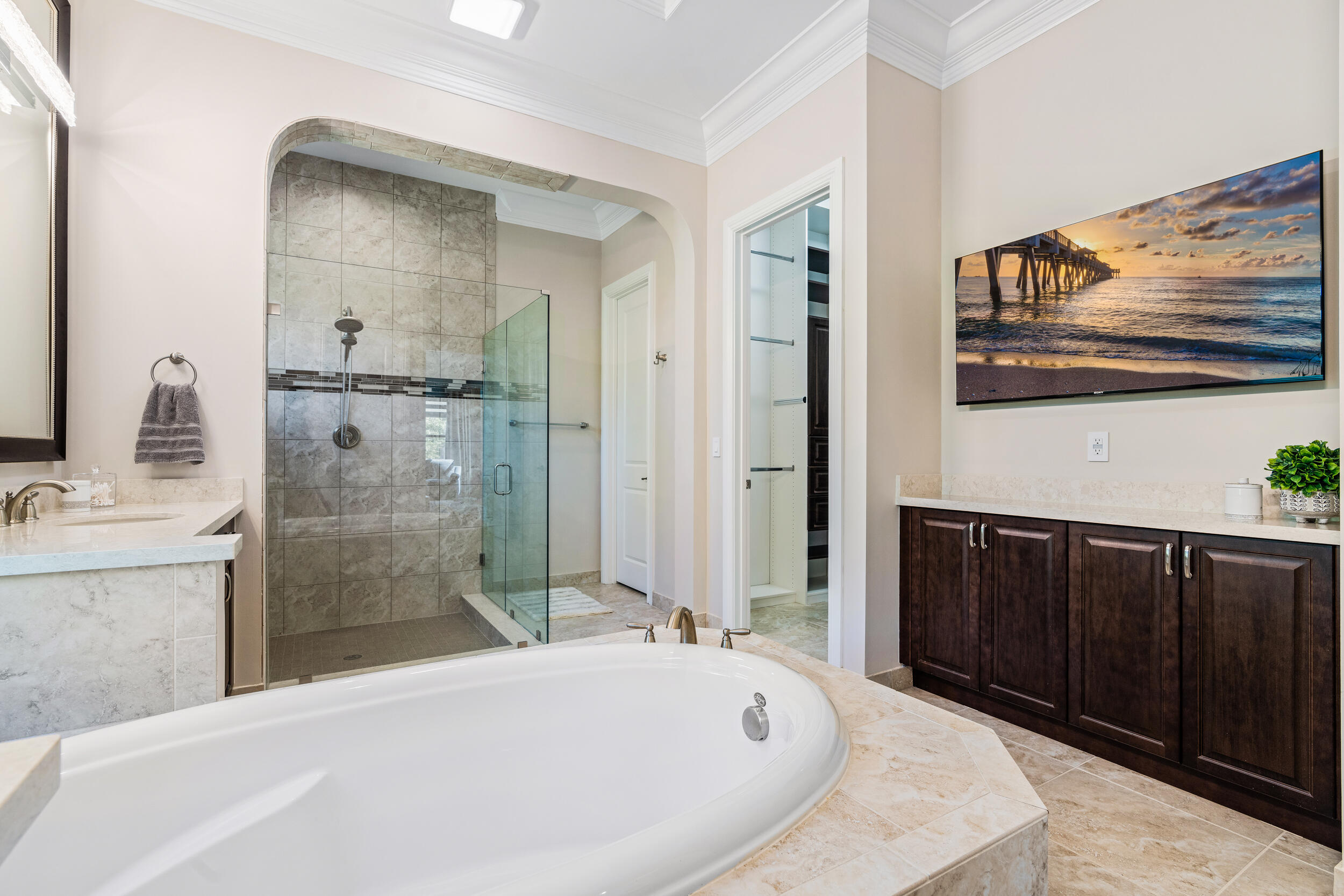 19240 Southeast Hidden Bridge Court Jupiter, FL 33458 - Photo 24 of 42 a bathroom with a bathtub and a sink