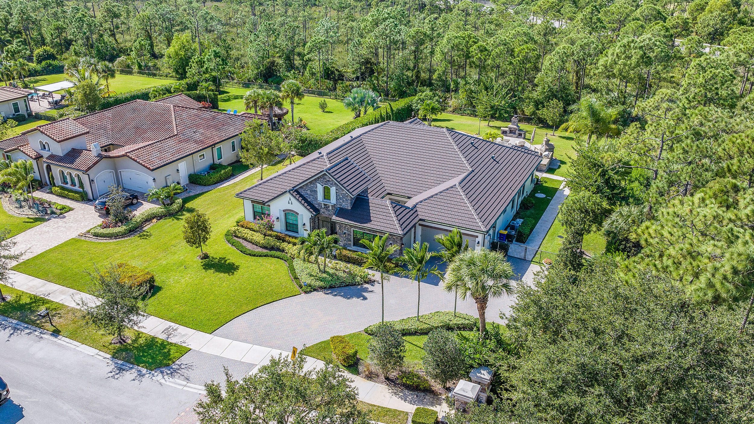 19240 Southeast Hidden Bridge Court Jupiter, FL 33458 - Photo 3 of 42 an aerial view of a house with a garden