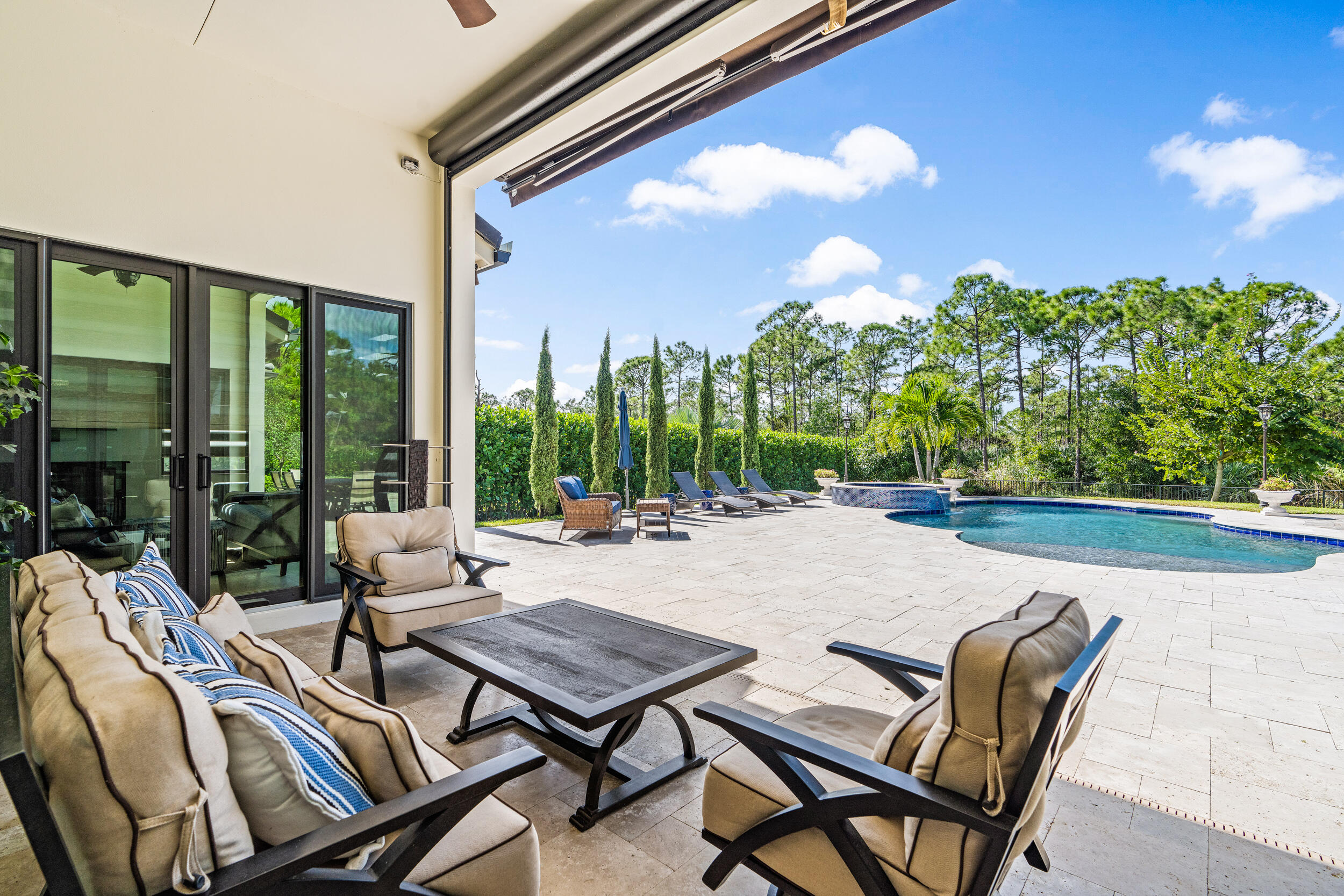 19240 Southeast Hidden Bridge Court Jupiter, FL 33458 - Photo 32 of 42 a view of a patio with swimming pool