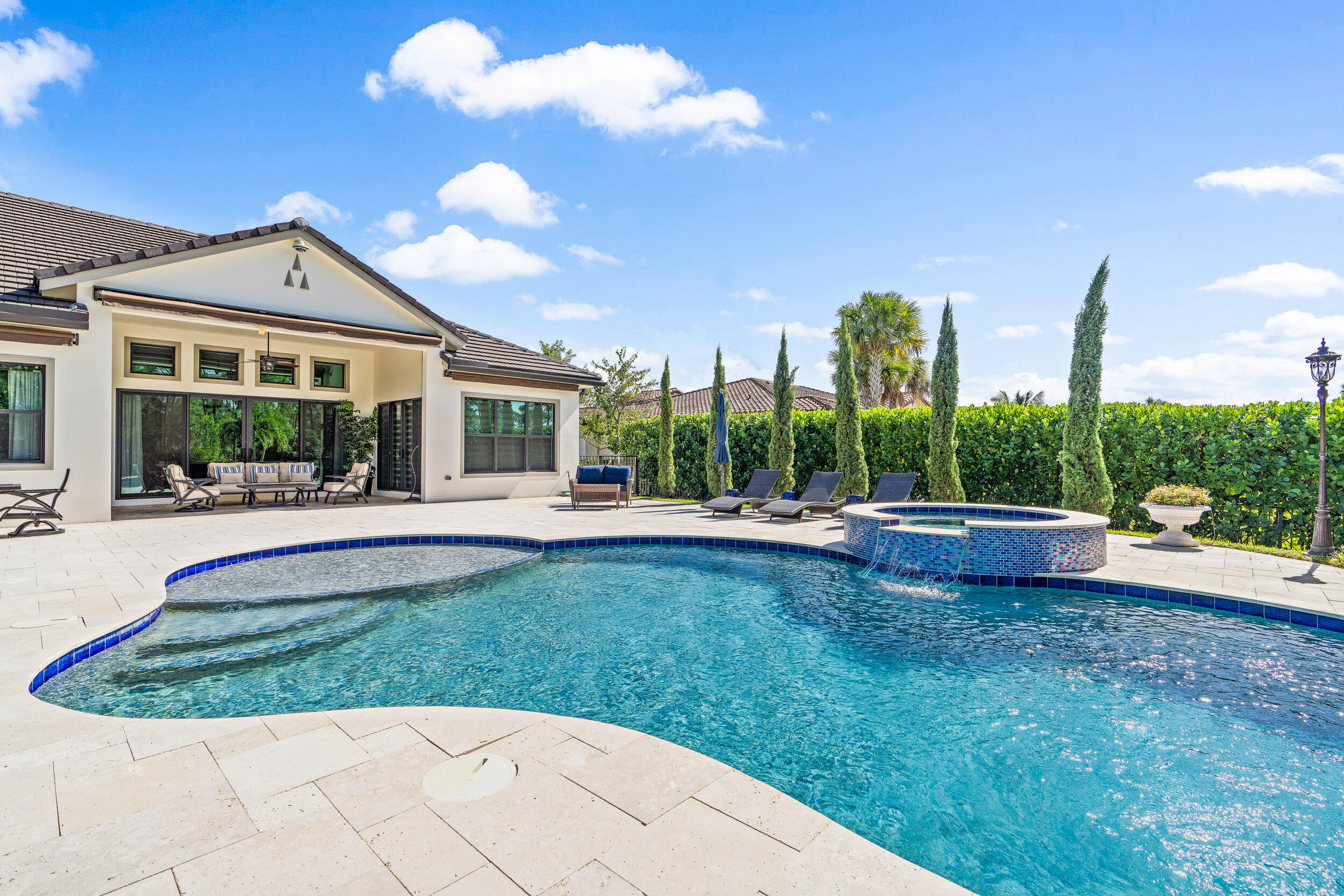 19240 Southeast Hidden Bridge Court Jupiter, FL 33458 - Photo 35 of 42 a view of a house with backyard and porch