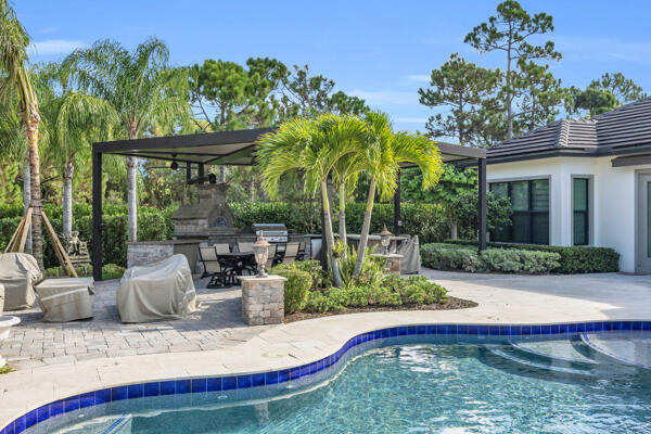 19240 Southeast Hidden Bridge Court Jupiter, FL 33458 - Photo 38 of 42 a view of swimming pool with a patio