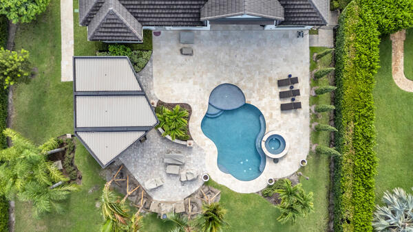19240 Southeast Hidden Bridge Court Jupiter, FL 33458 - Photo 42 of 42 an aerial view of a house with garden space and swimming pool