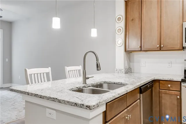 a kitchen with a refrigerator sink and microwave