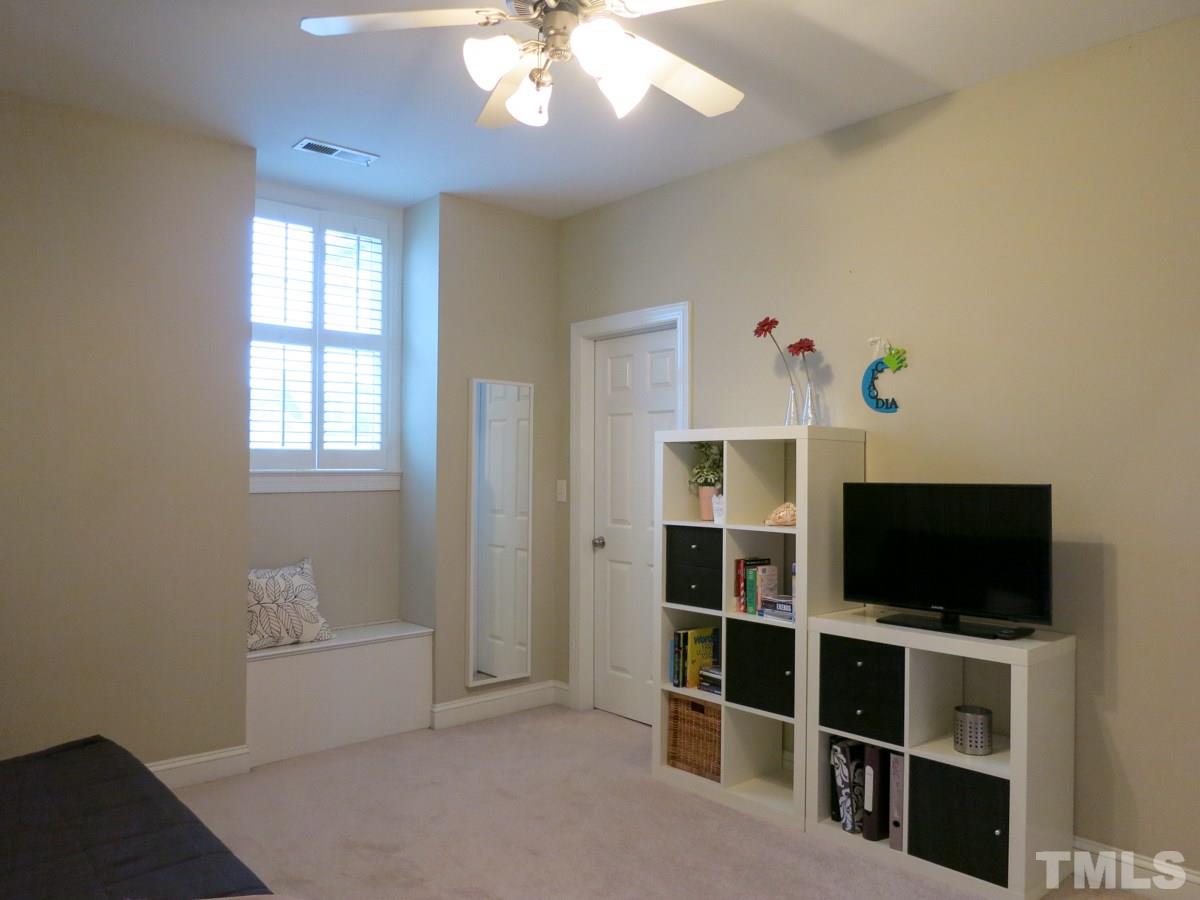3205 Canes Way Raleigh, NC 27614 - Photo 17 of 25 There are 2 add’l spacious Bedrooms w/neutral carpet, CFs & lg WICs. This is Bedroom 2 which has a window seat.
