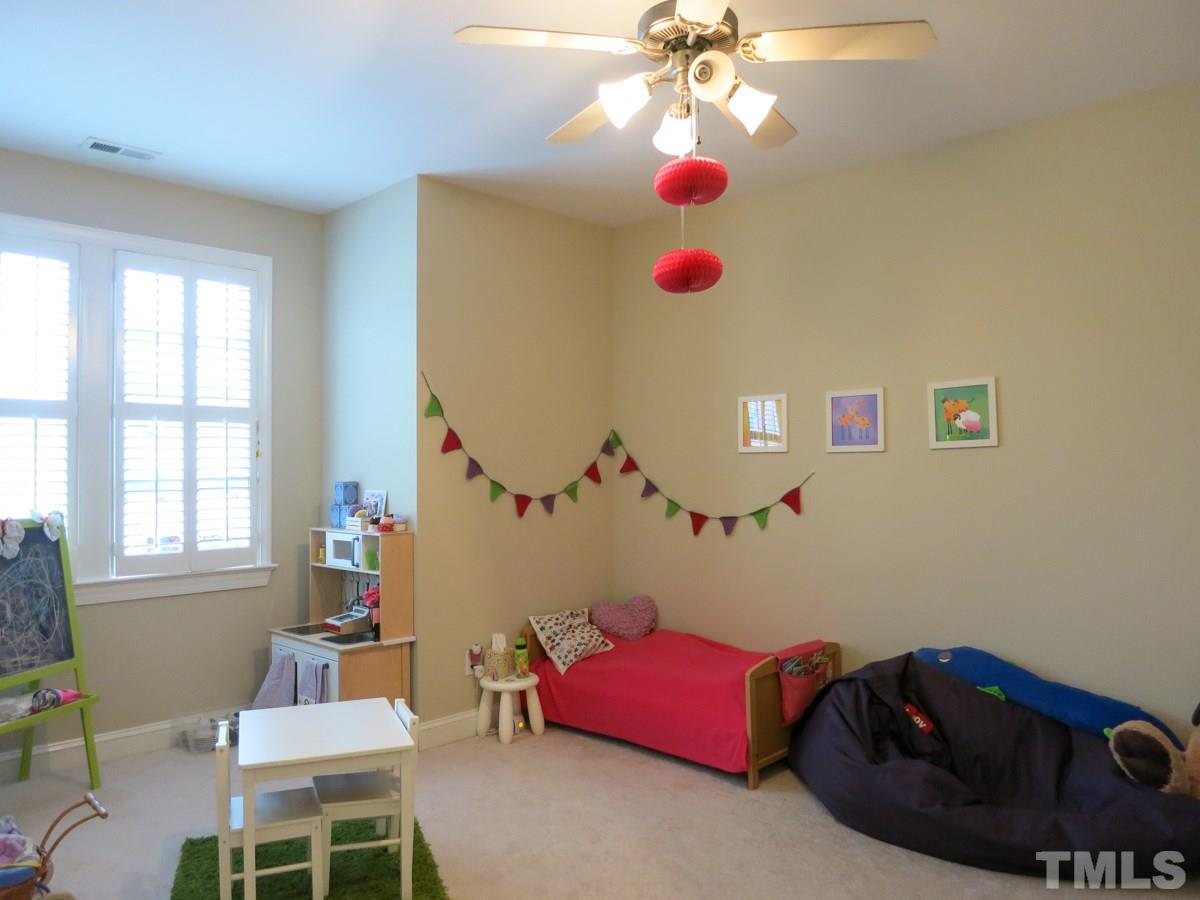 3205 Canes Way Raleigh, NC 27614 - Photo 18 of 25 This is Bedroom 3 which has access to an Attic storage area.