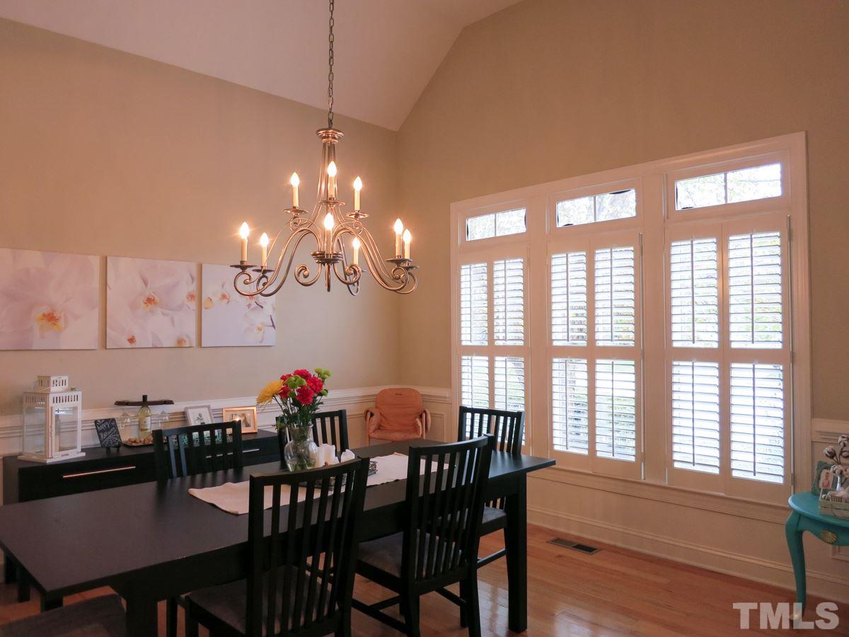 3205 Canes Way Raleigh, NC 27614 - Photo 2 of 25 Formal Dining Rm features hardwood flr, panel wainscot & chair rail molding.