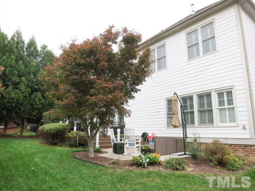 3205 Canes Way Raleigh, NC 27614 - Photo 20 of 25 There is a lg Patio & big Deck w/iron railings in the wooded backyard.