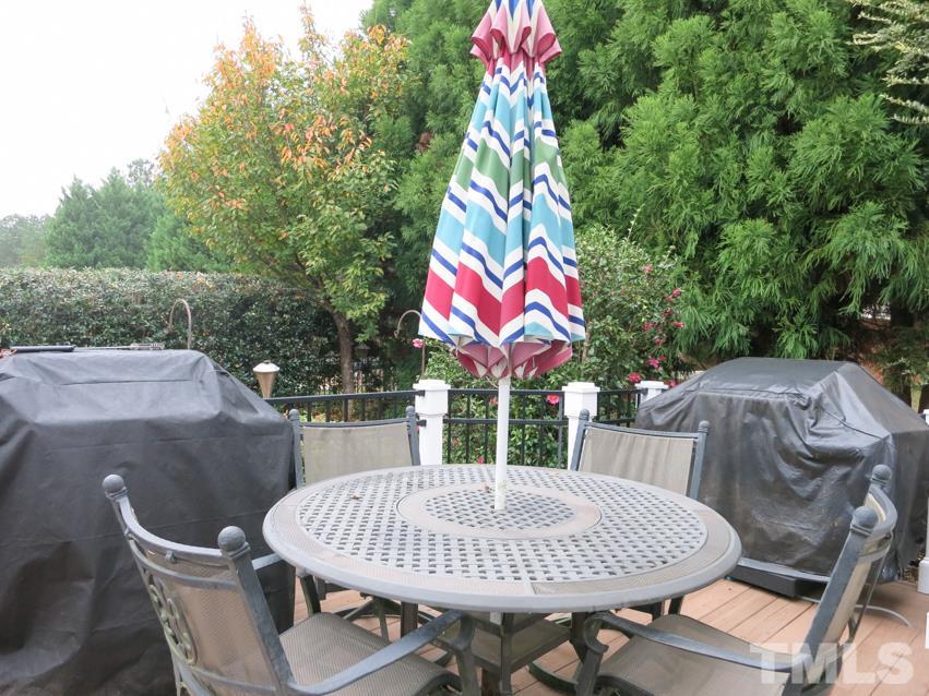3205 Canes Way Raleigh, NC 27614 - Photo 22 of 25 The Deck off the Living Rm has iron railings & gas line for the grill.