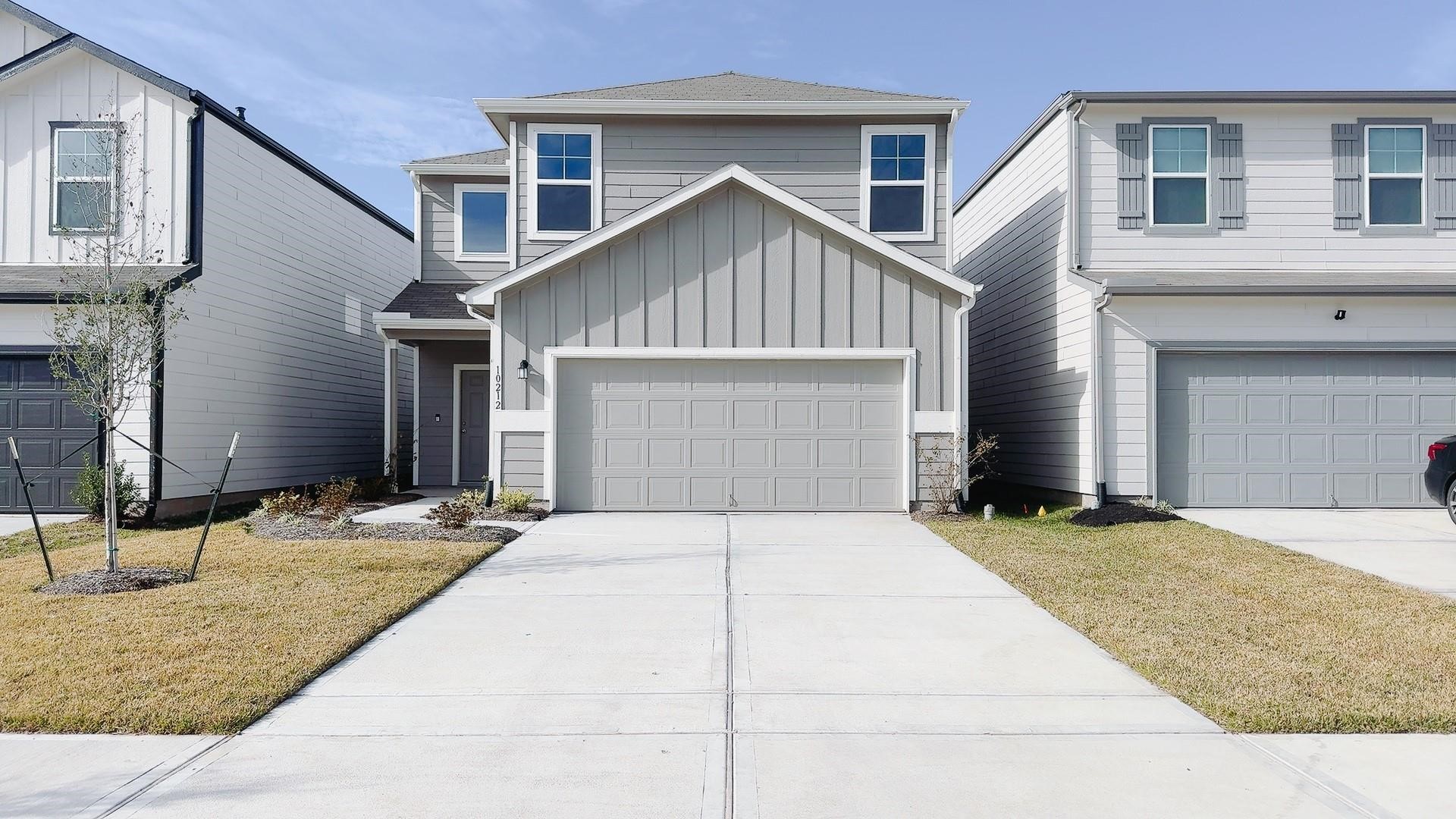 a front view of a house with yard