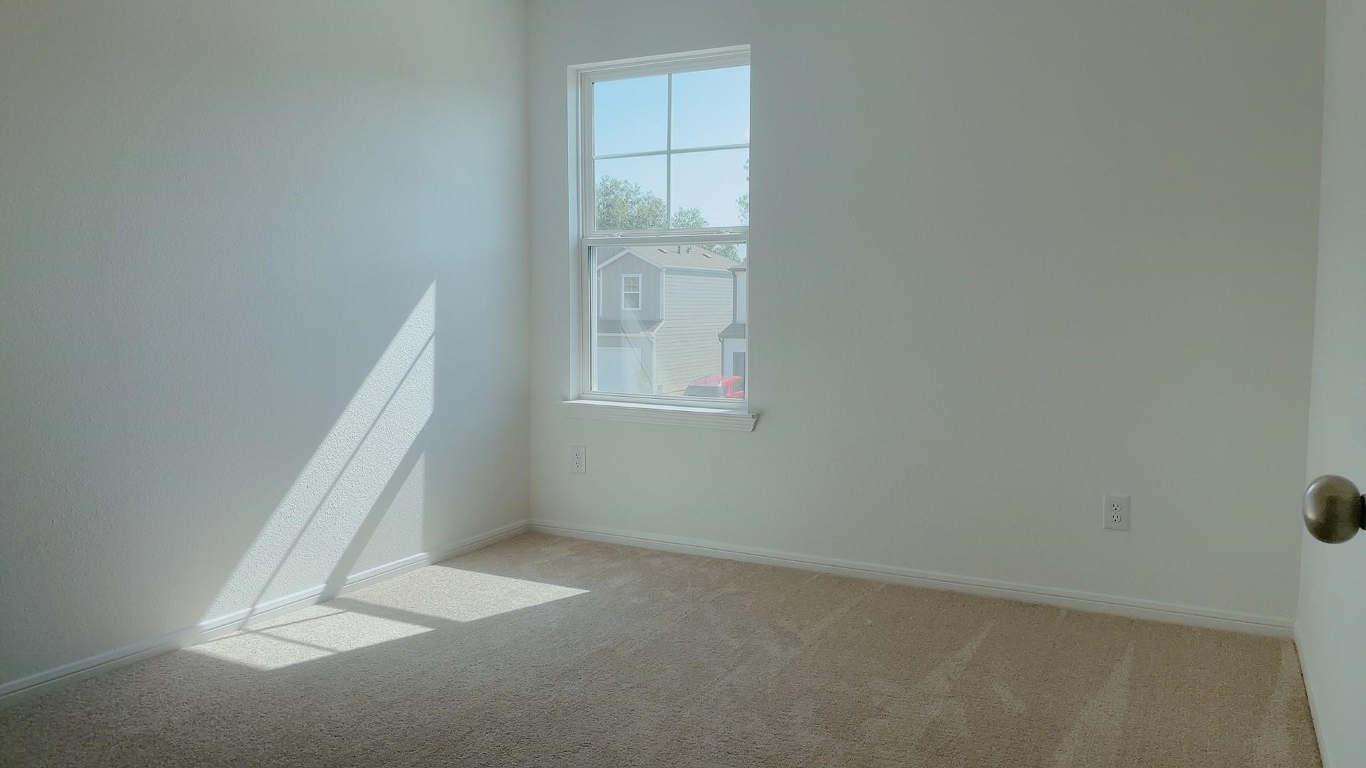 10212 Gates Mill Road Houston, TX 77034 - Photo 14 of 17 an empty room with a window