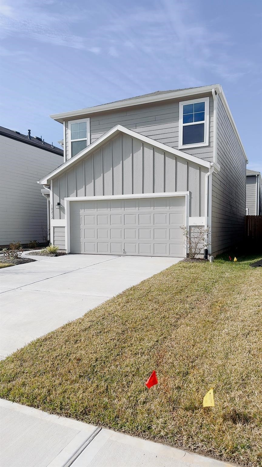 10212 Gates Mill Road Houston, TX 77034 - Photo 2 of 17 a front view of a house with a yard