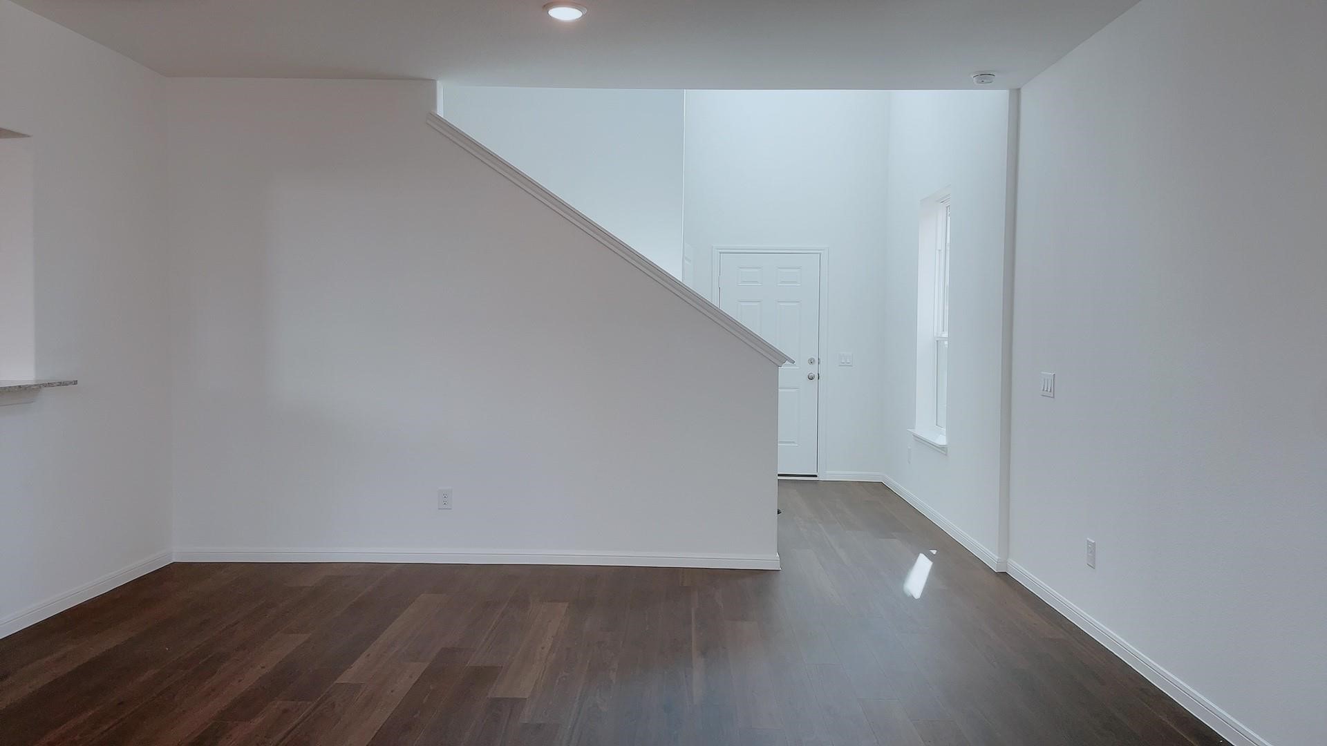10212 Gates Mill Road Houston, TX 77034 - Photo 4 of 17 a view of an empty room with wooden floor