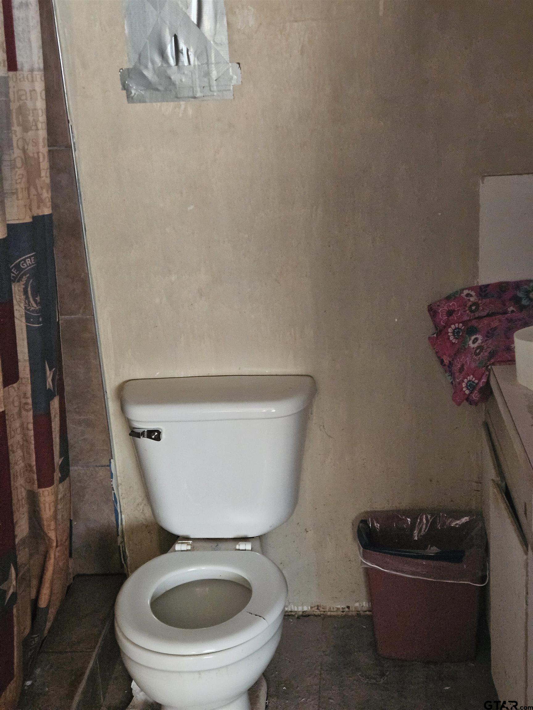 5542 Farm To Market Road 752 Rusk, TX 75785 - Photo 14 of 41 a white toilet sitting next to a small bathroom