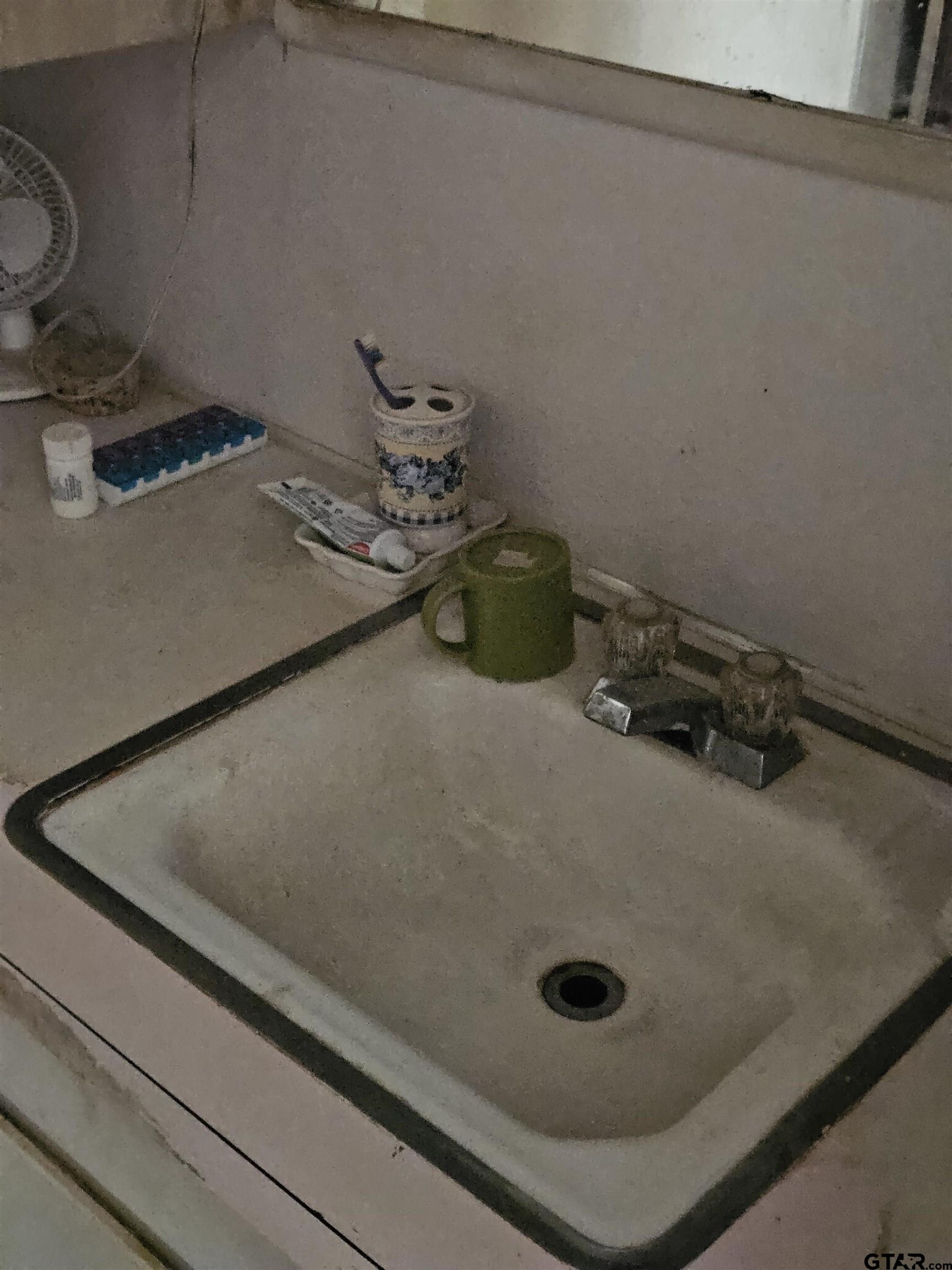 5542 Farm To Market Road 752 Rusk, TX 75785 - Photo 15 of 41 a bathroom with a sink and a mirror