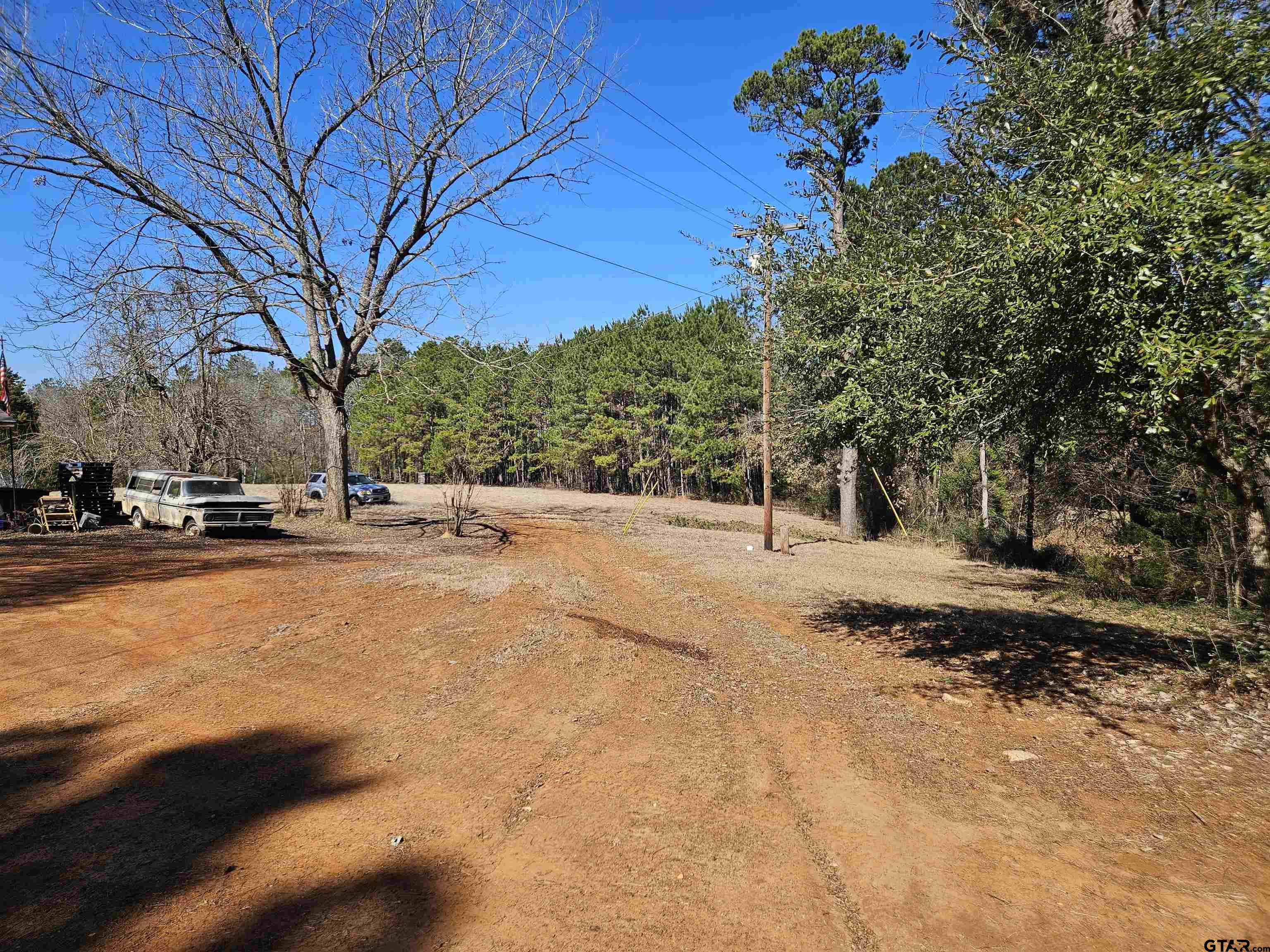 5542 Farm To Market Road 752 Rusk, TX 75785 - Photo 2 of 41 a view of road with with large trees