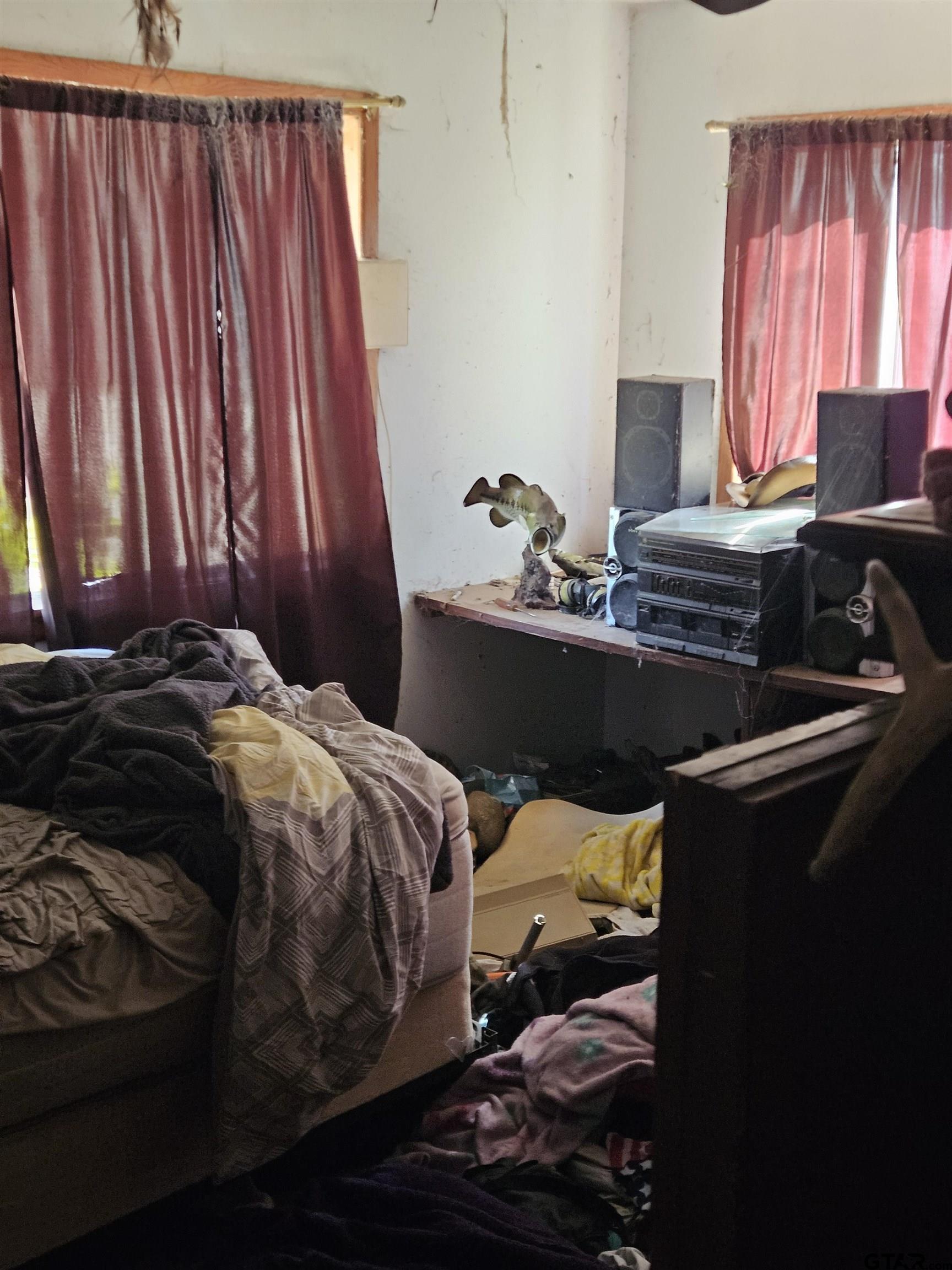 5542 Farm To Market Road 752 Rusk, TX 75785 - Photo 24 of 41 a bedroom with a bed and a window