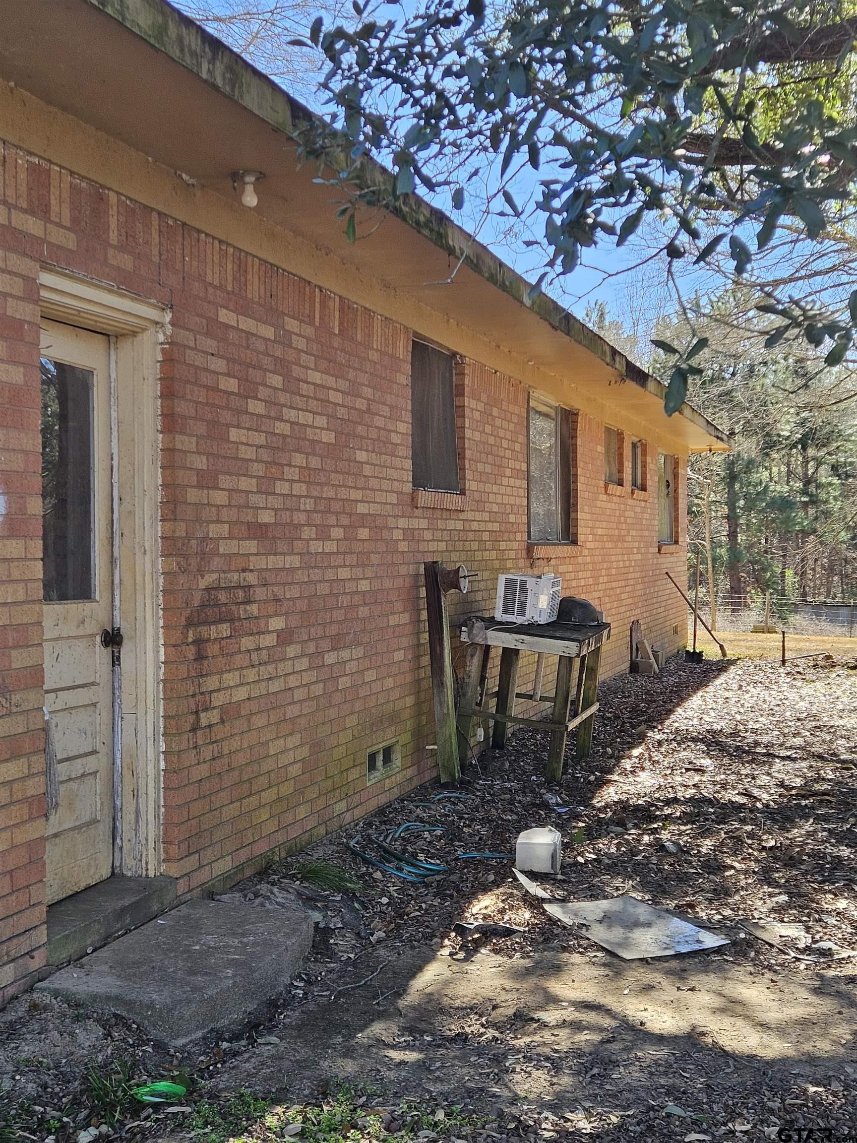 5542 Farm To Market Road 752 Rusk, TX 75785 - Photo 34 of 41 a backyard of a house with table and chairs