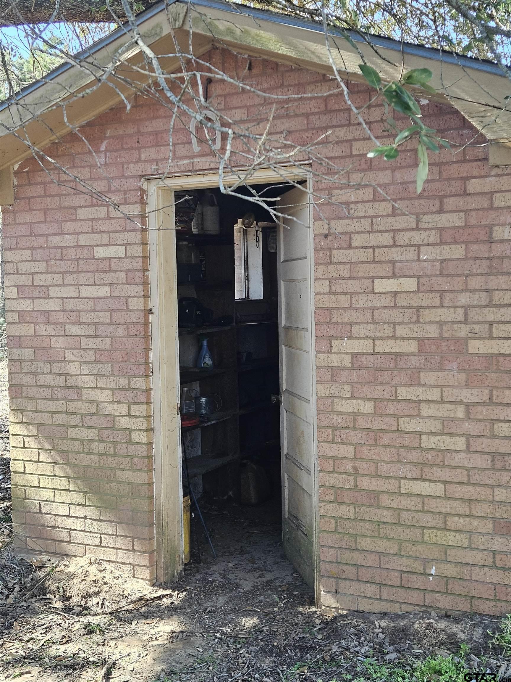 5542 Farm To Market Road 752 Rusk, TX 75785 - Photo 35 of 41 a brick building with a door
