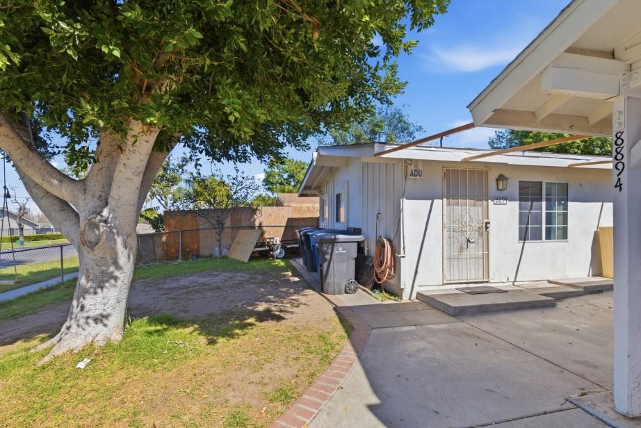 8894 Indiana Avenue Riverside, CA 92503 - Photo 14 of 16 a backyard of a house with yard and outdoor seating