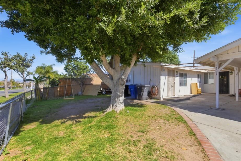 8894 Indiana Avenue Riverside, CA 92503 - Photo 15 of 16 a front view of a house with garden