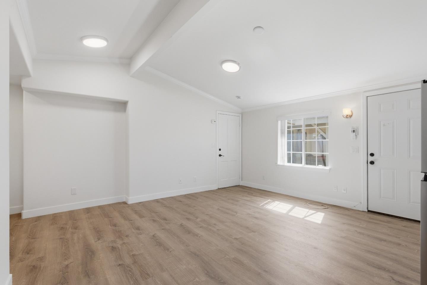 8894 Indiana Avenue Riverside, CA 92503 - Photo 2 of 16 wooden floor in an empty room with a window