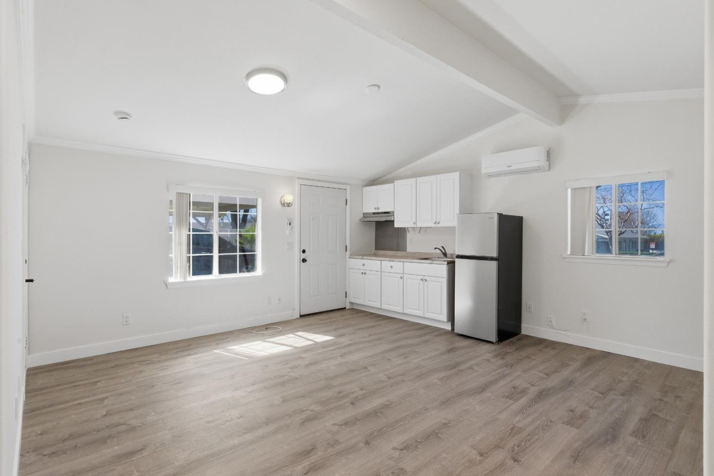 8894 Indiana Avenue Riverside, CA 92503 - Photo 3 of 16 a kitchen with stainless steel appliances a refrigerator and wooden floor