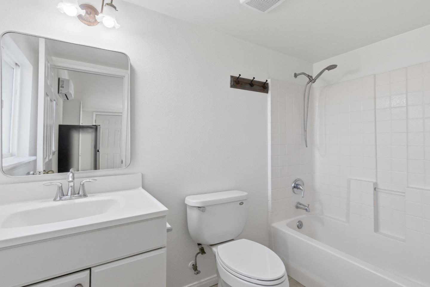8894 Indiana Avenue Riverside, CA 92503 - Photo 4 of 16 a bathroom with a sink toilet and shower