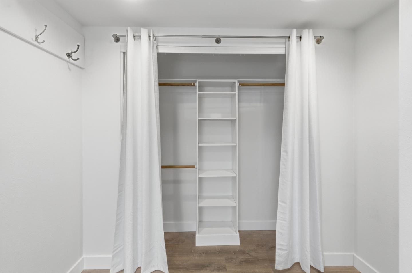 8894 Indiana Avenue Riverside, CA 92503 - Photo 6 of 16 a view of walk in closet with empty racks