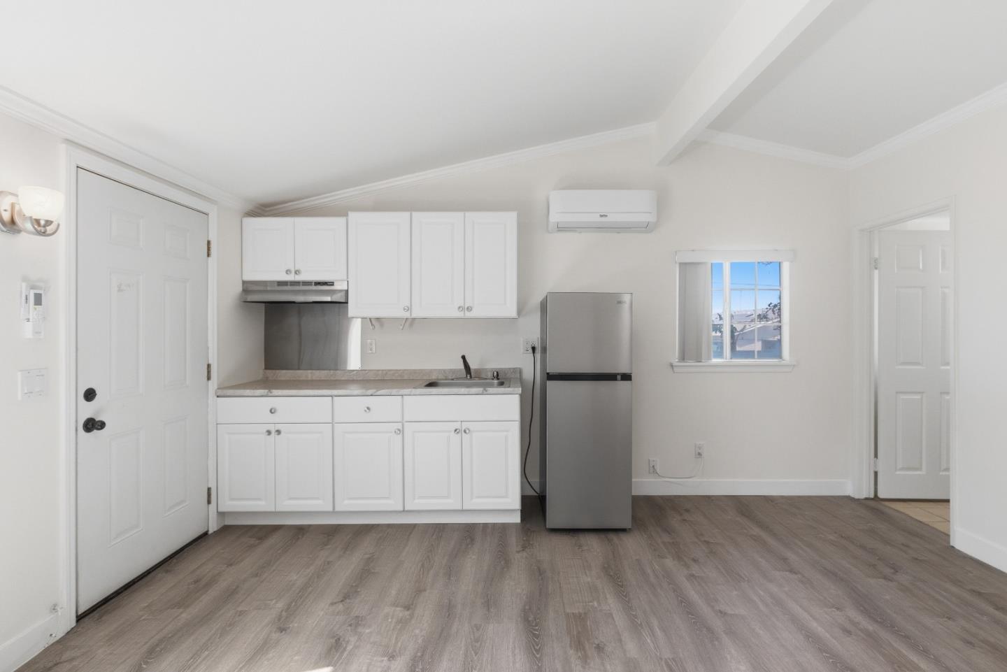 8894 Indiana Avenue Riverside, CA 92503 - Photo 10 of 16 a kitchen with stainless steel appliances a refrigerator sink and microwave