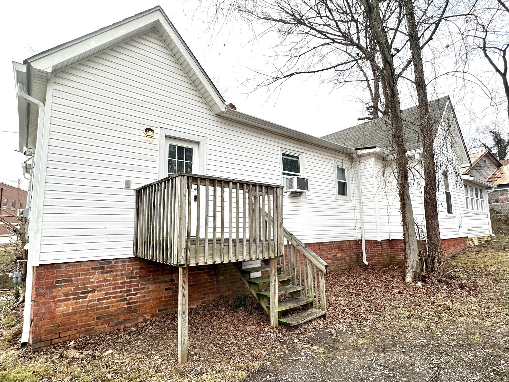 143 Emory Street, Unit C Clarksville, TN 37040 - Photo 13 of 13 a view of a house with a wooden deck and a backyard