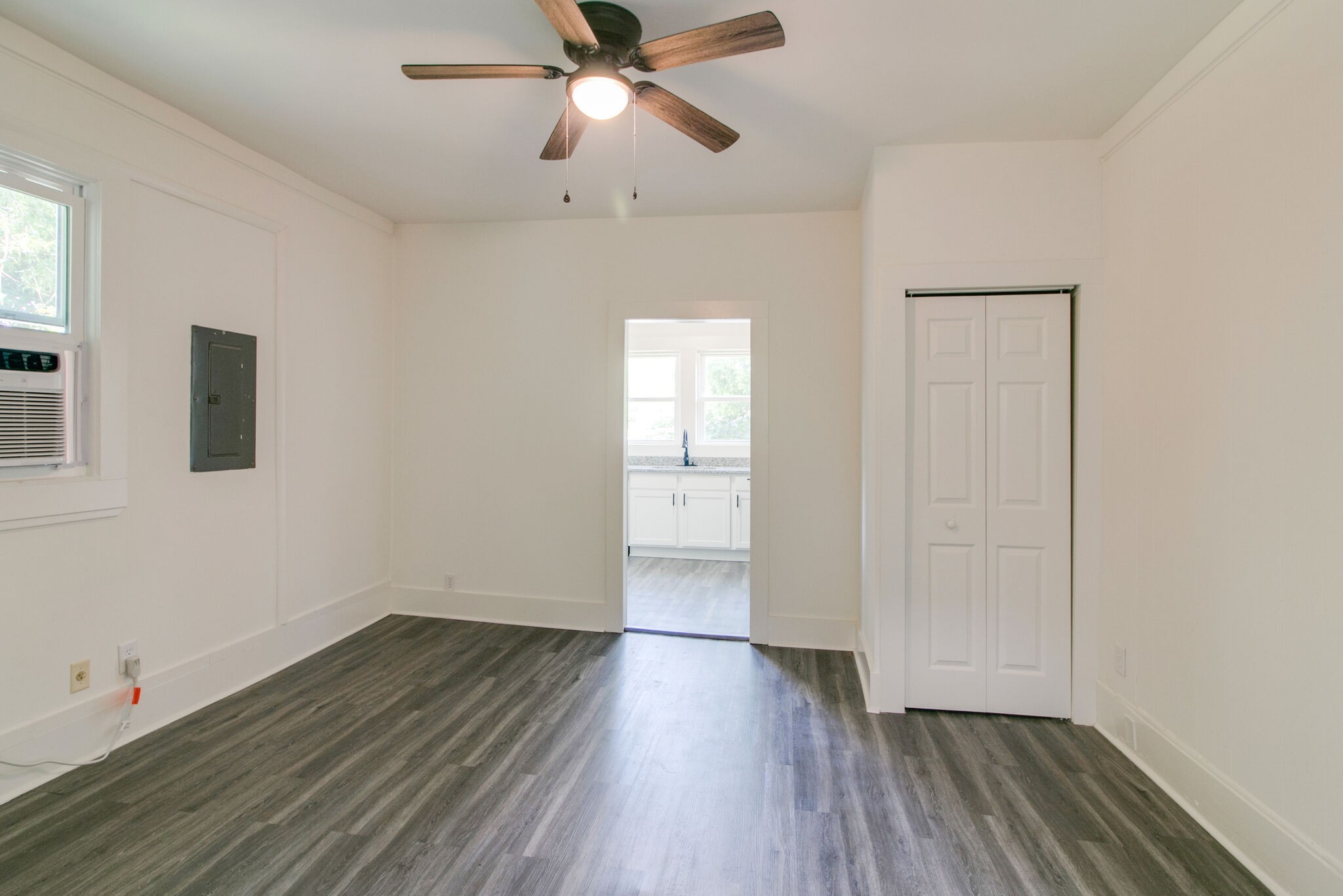 143 Emory Street, Unit C Clarksville, TN 37040 - Photo 6 of 13 wooden floor in an empty room with a window
