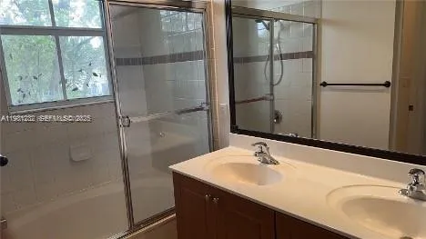 a bathroom with a sink and mirror