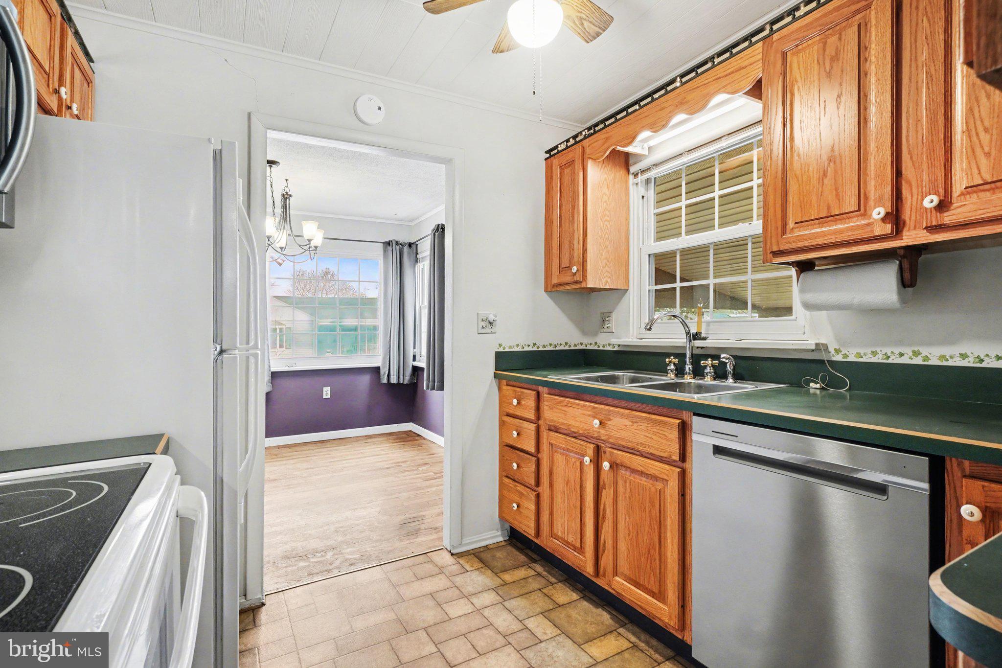 1309 Kingsley Road Camp Hill, PA 17011 - Photo 11 of 30 a kitchen with stainless steel appliances granite countertop a sink and cabinets