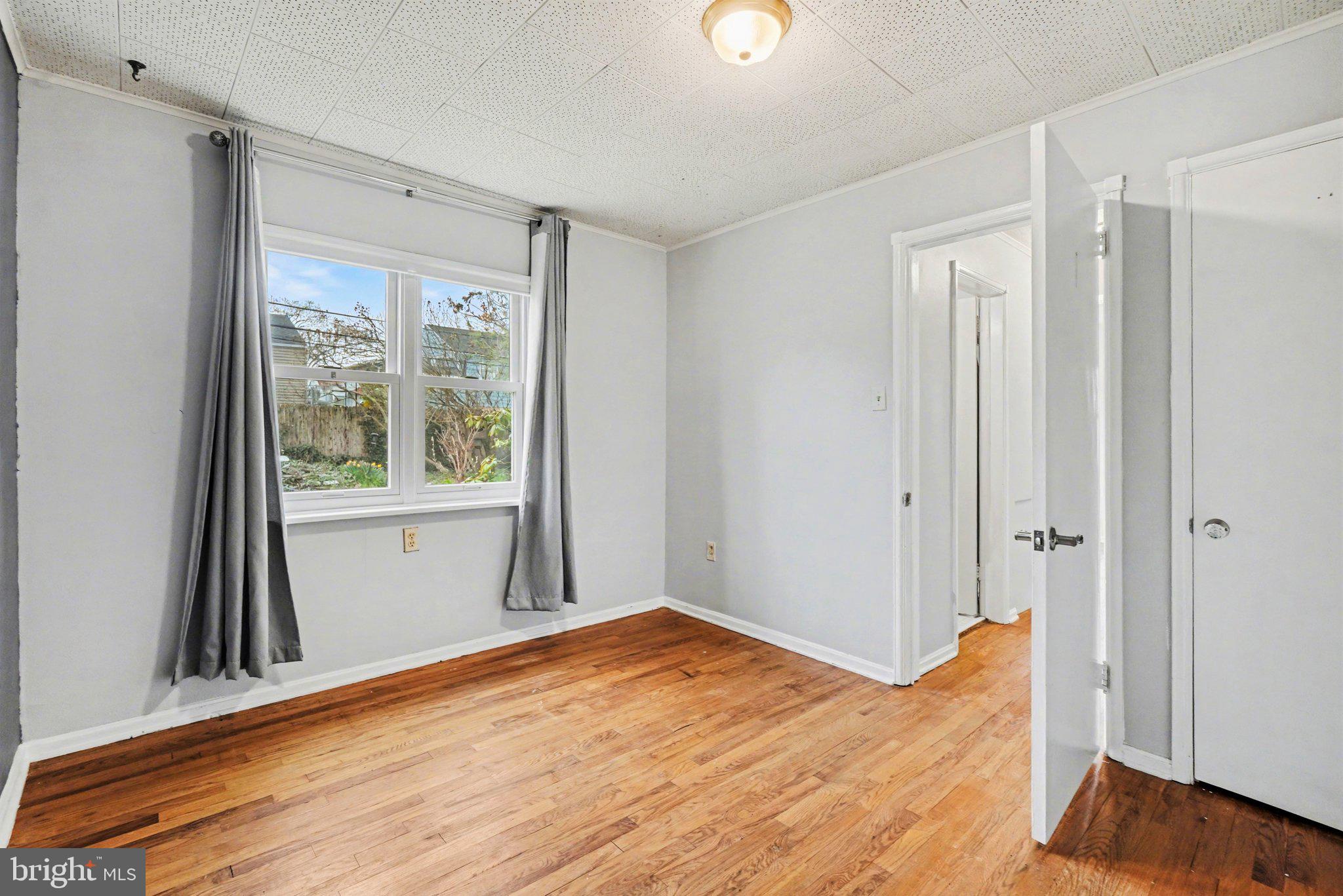 1309 Kingsley Road Camp Hill, PA 17011 - Photo 12 of 30 a view of empty room with wooden floor and fan