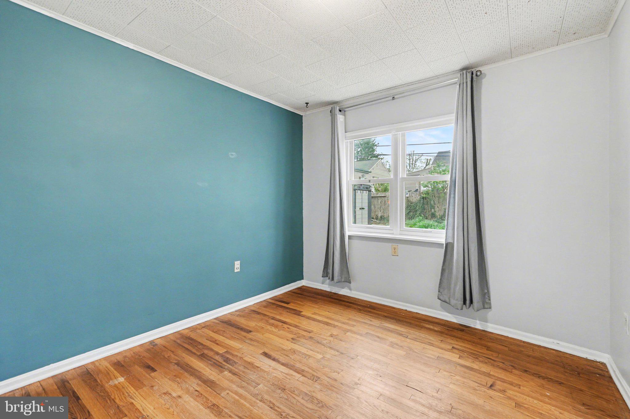 1309 Kingsley Road Camp Hill, PA 17011 - Photo 14 of 30 a view of empty room with wooden floor