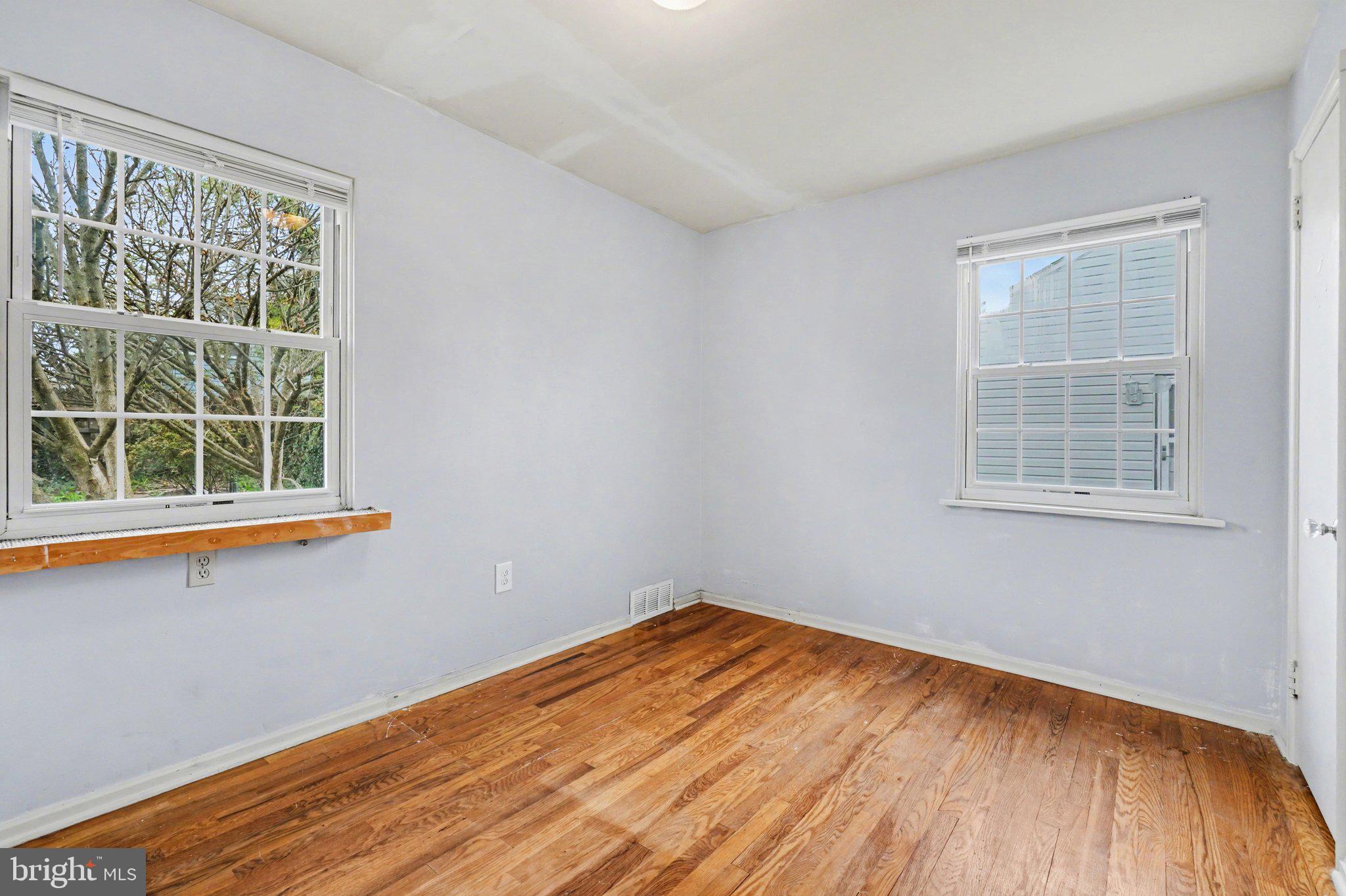 1309 Kingsley Road Camp Hill, PA 17011 - Photo 15 of 30 wooden floor in an empty room with a window